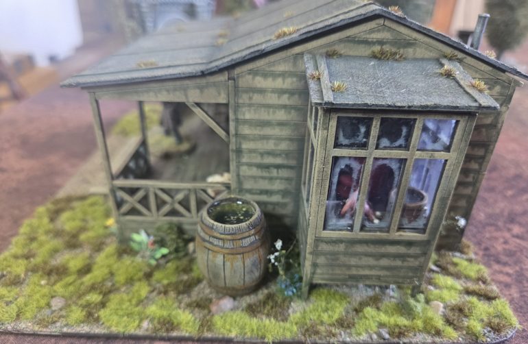 Here you can clearly see the dirtying down of the windows. The barrel had a final thin layer of Gorilla clear glue, when filling a deep cavity the glue shrinks back leaving a concave finish, so you need a thin layer to level off, this also gives me the opportunity to use scatter some leaves on top.