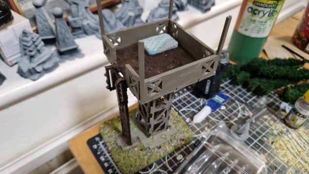 This was a tt combat ork watchtower. Bit of an older basic kit. Pain to assemble as the tabs weren't correct size/fit but after cutting them down whilst swearing i got it together. Left off the specific orky bits and am decorating with junk. Might make a canvas roof for it.