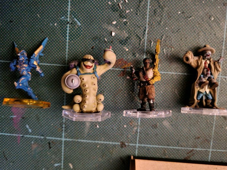 Dreadball coaches and side characters. Love the character of these guys. The lady in the middle i used the box art for colour scheme. The 2 zees in the trenchoat pretty much painted themselves. The water worm i loosely based on Slurms mckenzie from Futurama!  Wimmy wham wham wazzle! Will have to rescue Thoth as i dropped him just before this photo was taken and I couldn't find it or the Cartoush on the top of his head.