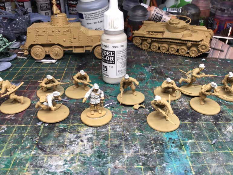 Started by painting the Nico of each unit hats Captain and Lt hats and shirt in deck tan to make them earlier to spot on table
