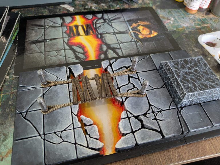 The Fire Chasm. I painted on wood-grain for the bridge, and marble effect for the plinth that will eventually hold my dragon