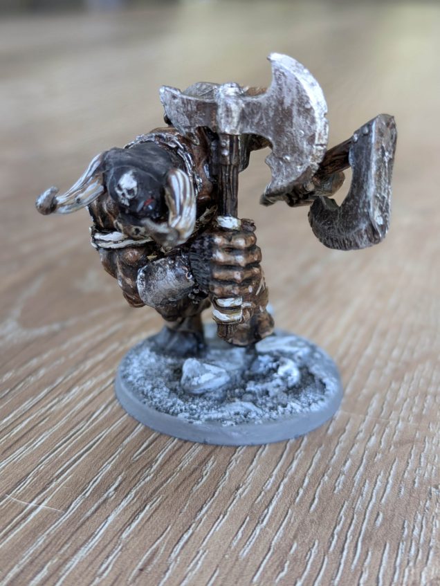 This last of the three minotaurs is also from Heresy, but is actually a fantasy football mini that I chopped the hands off and used my leftover weapons from the previous two minotaur minis. He's a tad smaller than the others, but he's in a much more dynamic pose