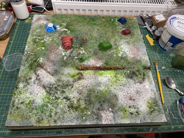 'flood' the board with watered PVA, hope that you cover it all but not enough to spill all over your desk and floor