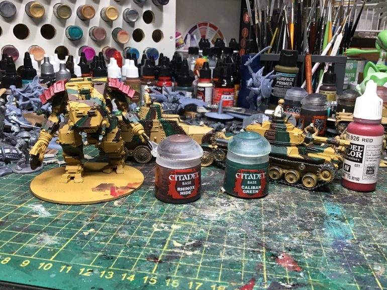 Painting camo over a primed colour of desert yellow with calibangreen and rhinos hide from citadel. Just by trying to breakup the solid yellow colour. Painted model color red on to the shoulder pad of the walker