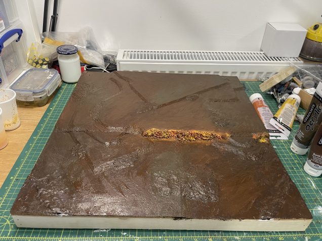 leave to dry, might go over the rockface with a light black wash to tone down after drybrushing, we'll see.