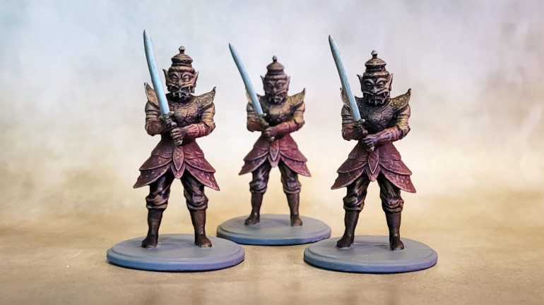 The armored guards were drybrushed gold over black primer, then I went in and did the red bits with speedpaint, followed by another light drybrush in gold, then some final highlights in Ancient Stone.