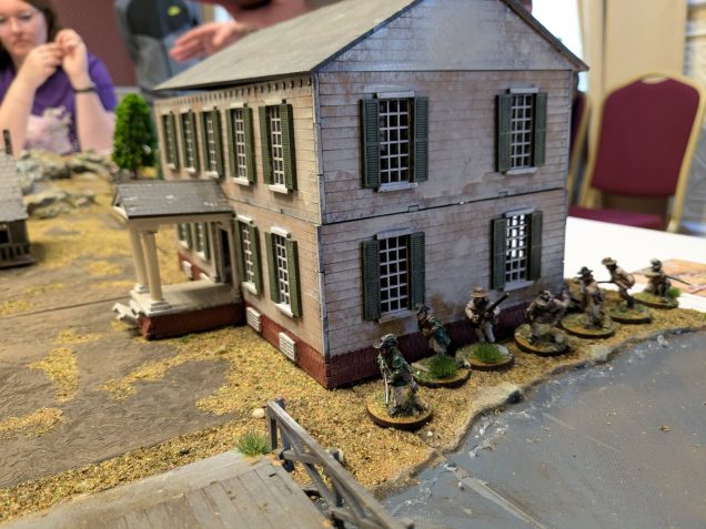I was sent some pics taken during the game by other players. Mainly a record of every figure that died and the animals that I sprinkled around the board. Although a few pics of the actual game did make it such as the rifleman trying to take the house from the Germans.