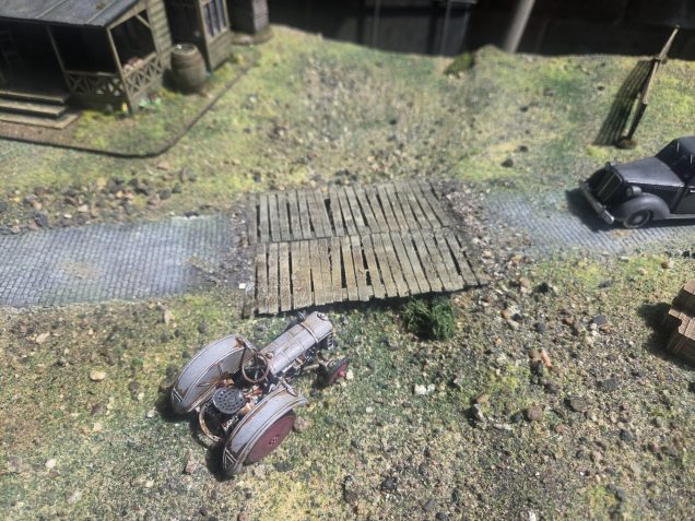 For the bridge, I used a couple of trench walkways from my abandoned Trench Crusade project (made from coffee stirrers and wood strips from Cornwal Model Boat Company