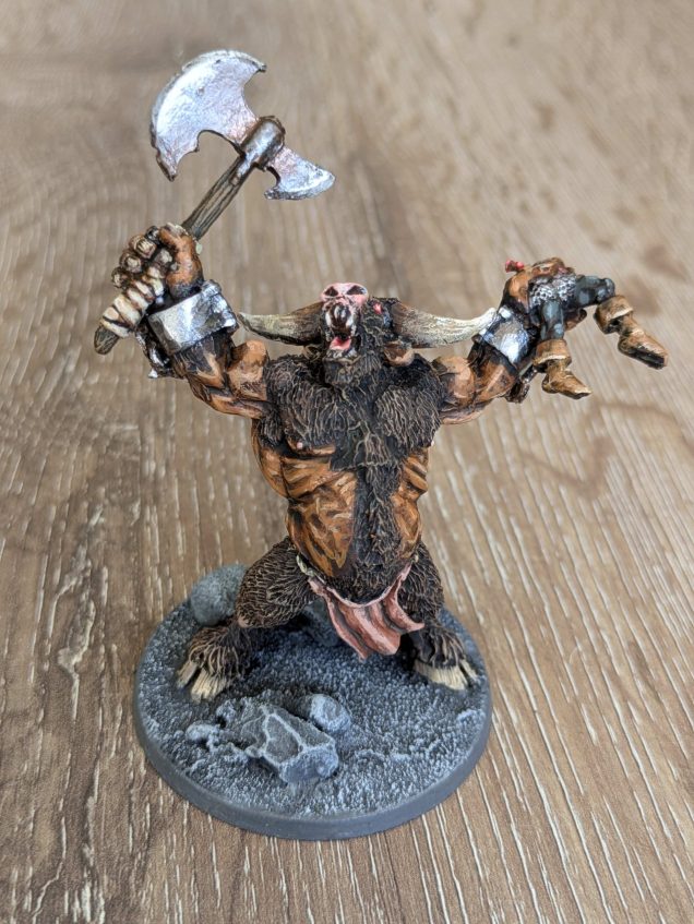 For the Minotaurs I went to Heresy Miniatures. It's a much bigger sculpt than the original WHQ minis, but it's also a bit more dynamic with a warrior's half-dismembered body in one hand 