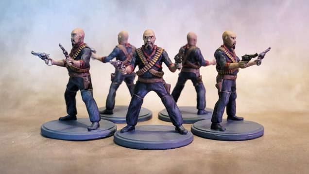 I will admit that I didn't want to spend too much time on these. I drybrushed them in dark grey over black primer, then painted in the faces, hands, weapons, etc with traditional paints and washes.