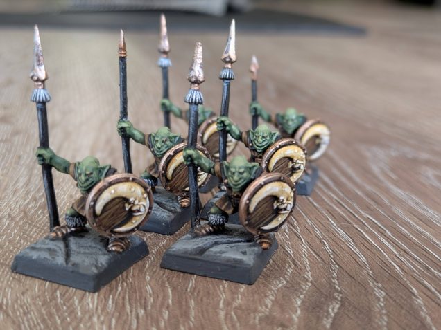 I was also lucky enough to find 6 Goblin Spearmen - not all the spears survived so another hunt through the bits box for spares was needed. I also wanted all the Orcs and Goblins to have the same shields, so after looking through my old collection I scrounged enough moon-face shields to suit my purposes. These minis hadn't been painted in 1995, so I was free to choose a colour scheme. I departed a little form the bright '95 reds though. I wanted something a bit more grounded and authentic, so I went with brown leather