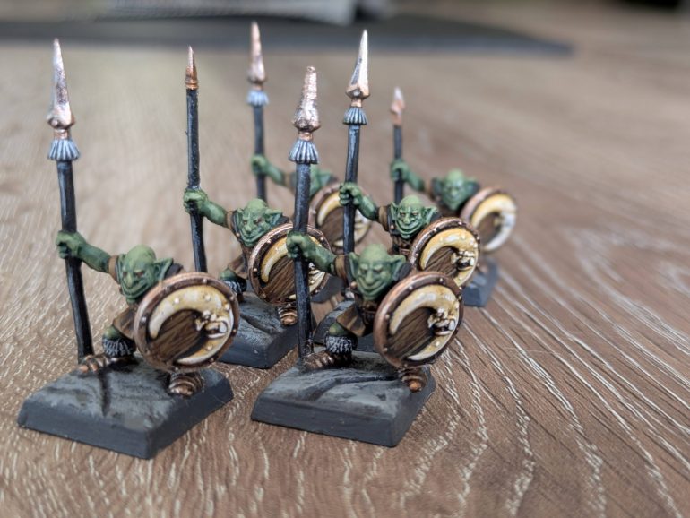 I was also lucky enough to find 6 Goblin Spearmen - not all the spears survived so another hunt through the bits box for spares was needed. I also wanted all the Orcs and Goblins to have the same shields, so after looking through my old collection I scrounged enough moon-face shields to suit my purposes. These minis hadn't been painted in 1995, so I was free to choose a colour scheme. I departed a little form the bright '95 reds though. I wanted something a bit more grounded and authentic, so I went with brown leather