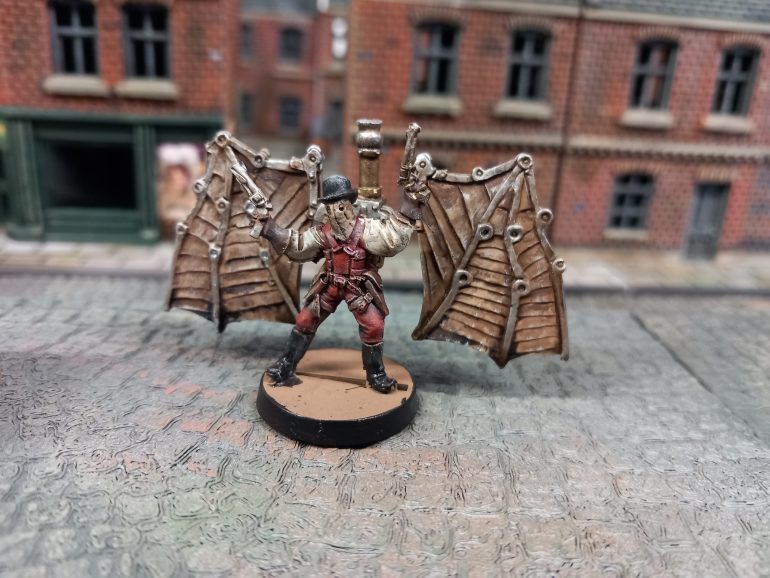 The mechbat swoops down on his foes.