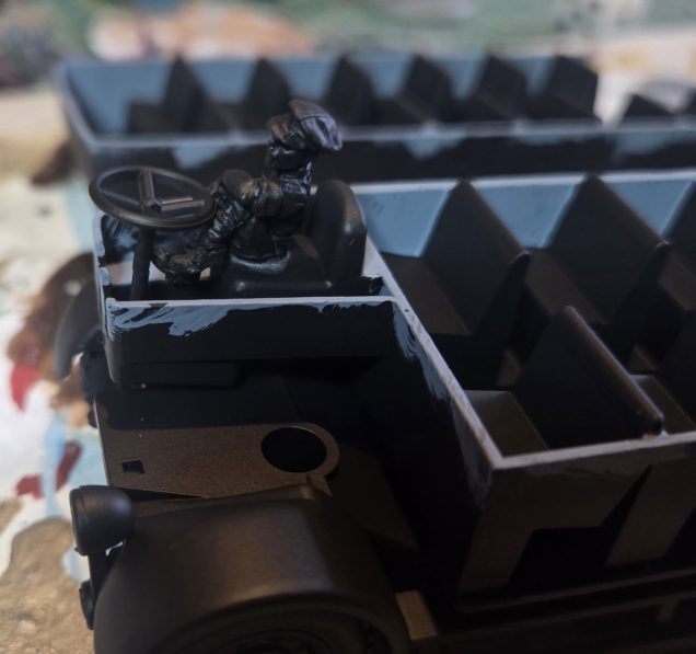 I found this WW1 driver in my bits box, with a bit of trimming and sanding he fitted in nicely.