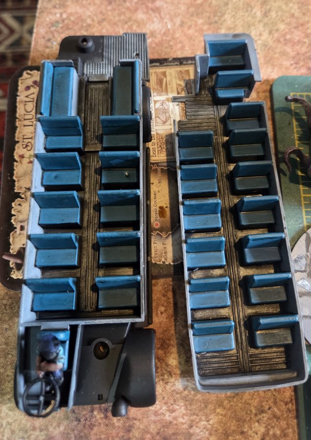 I drybrushed the seats with the turquoise progressively adding white until I was happy. Sorry no photos of this next bit. I drybrushed the walls with the French Grey and again adding white. The driver was also highlighted up. The black paint was drybrushed and the tyres painted.