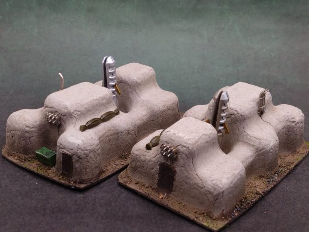 The bits and bobs from 15mm tank sprues really helps tie the buildings to the scale and hide the humble packaging beginnings of the pieces.
