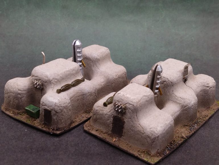 The bits and bobs from 15mm tank sprues really helps tie the buildings to the scale and hide the humble packaging beginnings of the pieces.