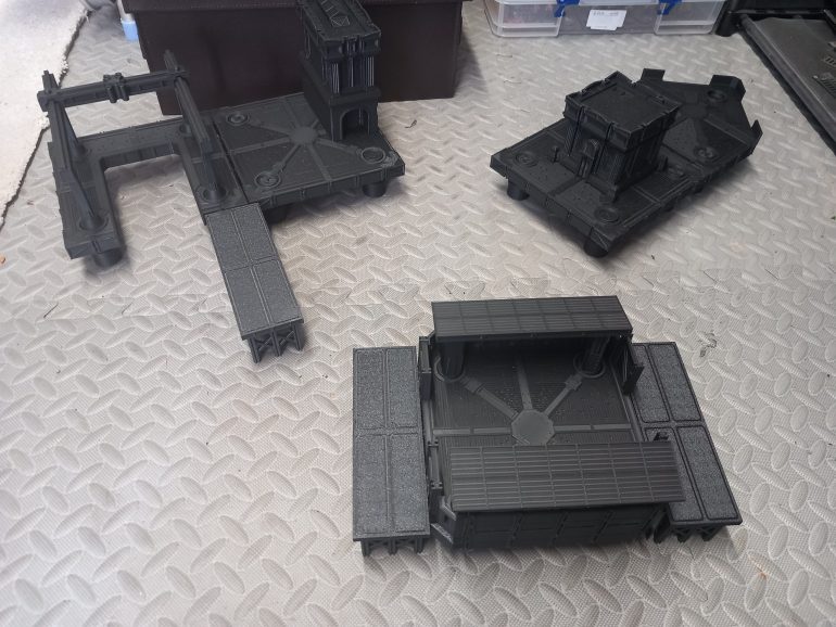 I've spent the last couple of weeks printing out everything needed for the starter campaign. The docks are a great modular kit that can be rearranged for each scenario. They do warn you not to glue anything together.