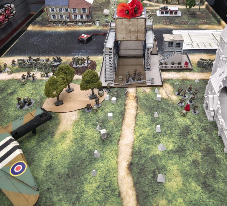 First casualty, both German  sentries  get knifed in the darkness,  also first British casualty in the brief close combat with the sentires.  And gun fire breaks out at the bridge control  building 