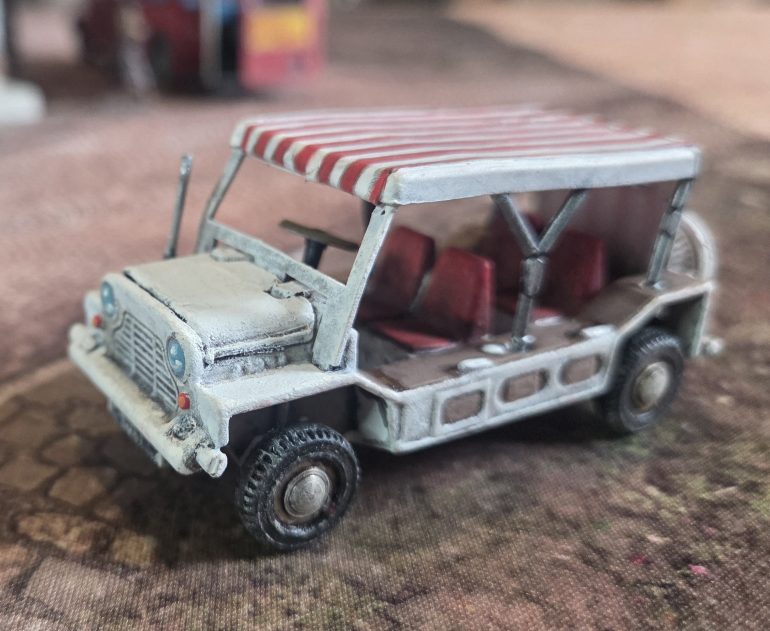 The original interior was all white. So I painted red seats and a black dashboard and steering wheel.