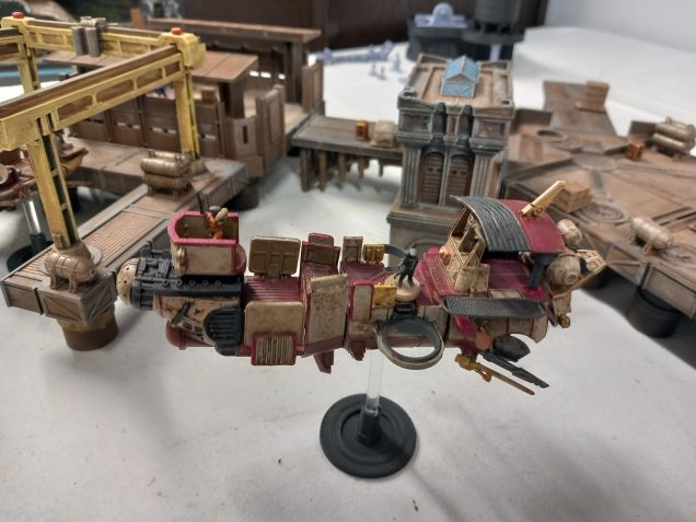 Often mis spelt as thug boat in the rules. My tug boat for the pirate fleet currently has no weapon upgrades. The clear stand are plastic rods purchased from amazon and they slot into the stands and boat