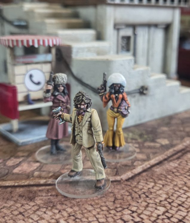 Regal Vanguarde Pryce, Compere of Le Cabaret Velvette (inspired by Jason King from the brilliant Department S) with The [] Terminus Olga Blok and Carmine Three Android Sleeper Spy.