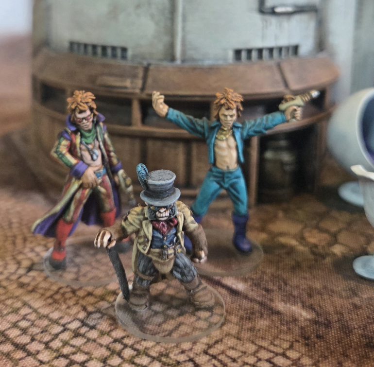 Dapper Monkey Archie Borte 1st Viscount of Ruffley and two Alien infiltrators. The two Infiltrator outfits are based on actual outfits, the turquoise one from the cover of Ziggy Stardust ( this figure was one of the initial releases, now made available again, which I had already painted. and the gold stripped one from a photo. 