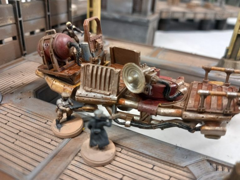 Yhe captain and surviving crew climb aboard and after a mechanical roll get the vehicle started. They make their escape but now need to find their impounded tug boat