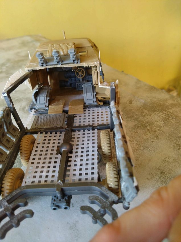 I snuck a steering wheel in the cab, but I think I made.this as so strictly a gaming piece that I don't think it could possibly turn even if it wanted to. (Given how tightly the wheels are set to the chassis.)