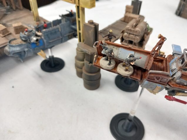 Shots are fired at the pirates as the fuel is rigged to blow