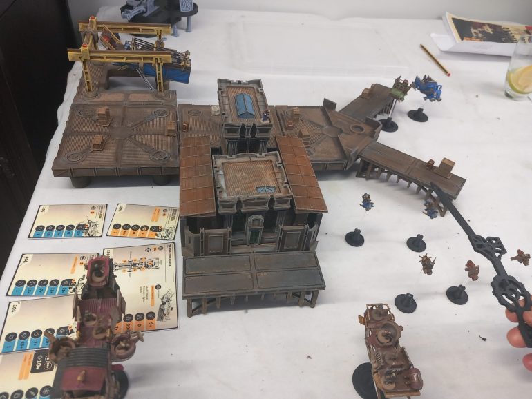 Company and pirate bikes clash as the larger vehicles move in. A gunner users his gocket launcher to blow a hole in the harbour masters door