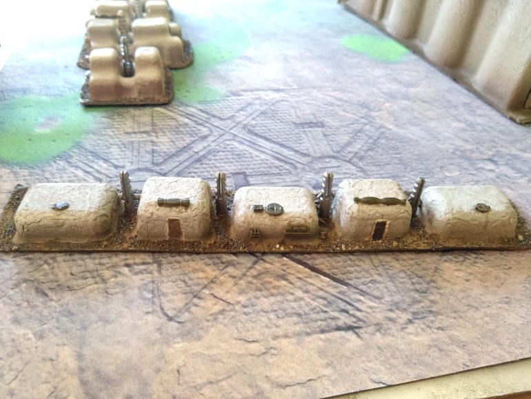 These shorter pieces in a line were from different packaging. I couldn't find a use in 28mm as they were so low, but these suit the 15mm scale and the aesthetic I am looking for. My son said 