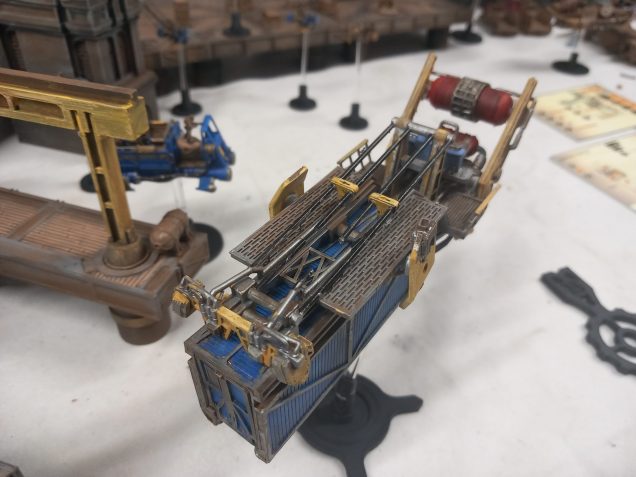 Cago hauler carries a removable container and to help balance it has an unusual angled stand