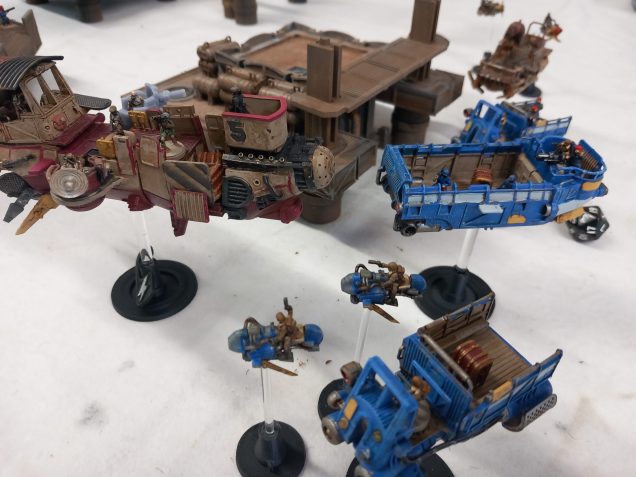 The pirate tugboat tries to intercept and boards the barge seeking plunder. Unfortunately the plunder turned out to be on the small truck that slips past