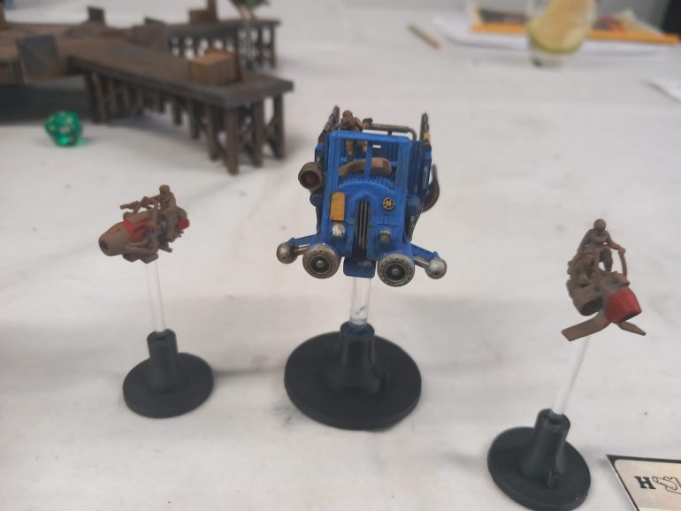 The truck slams on hover mode knowing that the pursuing bikes have to take a compulsory move forward smashing into it's rear and both spin away taking damage