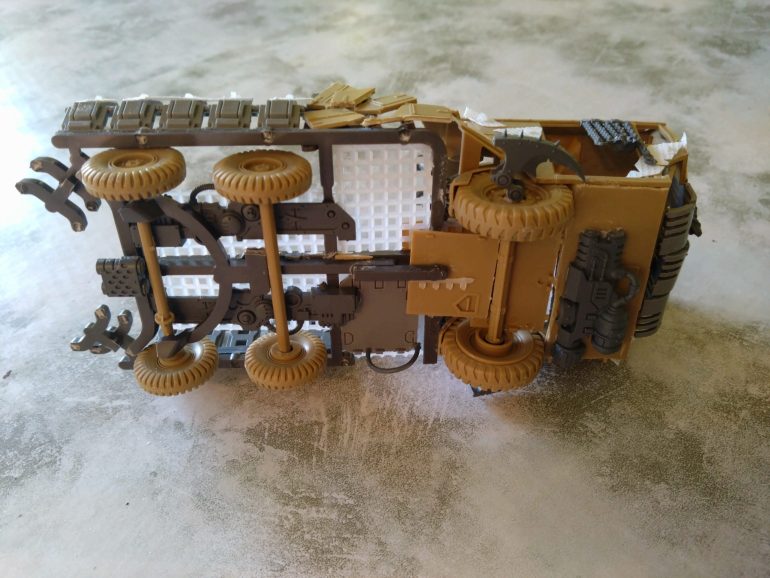 I used a chunky sprue (The one that comes with the Blood Bowl rulers) to give me a chassis for the rest of the truck. Granny grating over Wardog spare weapon halves gave me a flooring. I wanted the weapon halves to give me a look of something mechanical going on under the Trukk..   