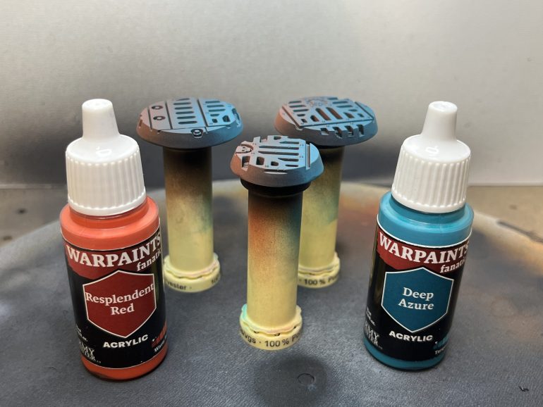 Some contrasting colours airbrushed on.  Aiming to simulate the ambient light, perhaps in a spaceship or a forge world.