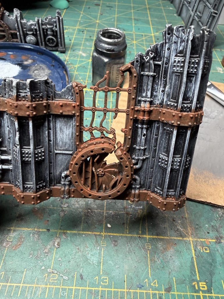 You then choose some accent of the terrain tht you will want to portray as rusted metal and apply one layer of brunt umber (use craft paint as hobby paint are far too pricy for this), followed by a dry brush of raw siena. 