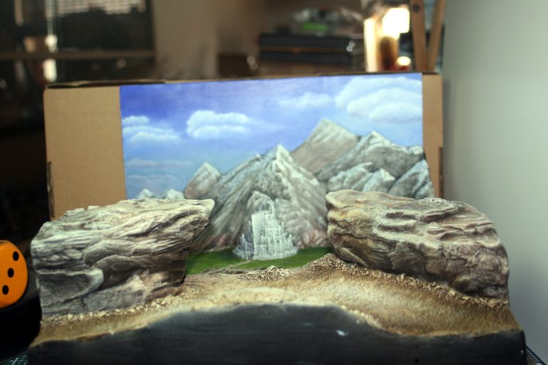 I added shadows and highlights to the foreground with oils paints - the two promontories and the pathway.