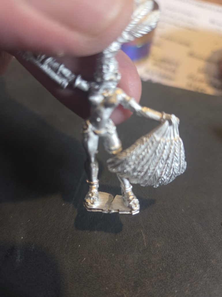 This next bit is important I make a cut applying minimal pressure to the clippers, equidistant between the two feet this avoids bending the legs out of shape.