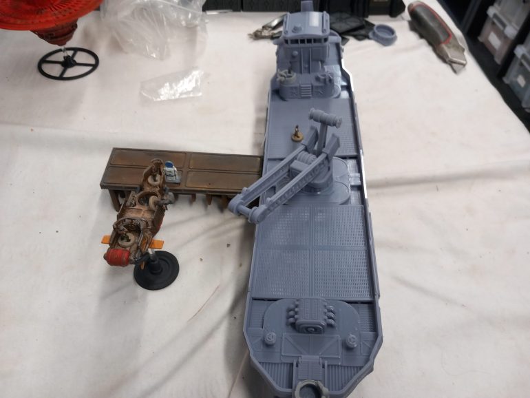 The biggest ship I've printed so far for the game so far and in resin. The cargo ship acts like scenery in the scenarios when our pirates raid it.