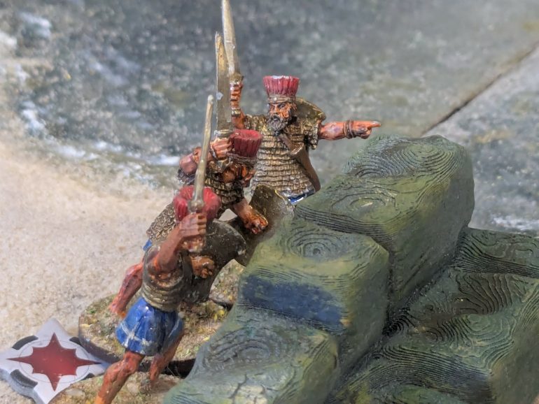 Using cover the temple guardians block the invaders advance 
