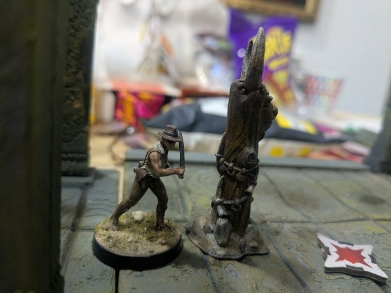 After seeing off the queen liliana jones reaches the third stone. A portal opened up leading bank to civilisation. As Dr jones Stepps through it she fails to spot the islands inhabitants follow on behind 
