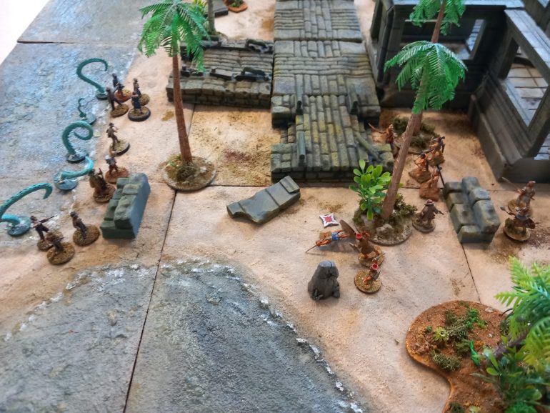 The islands defenders approach the invaders who fire at them to keep them back 