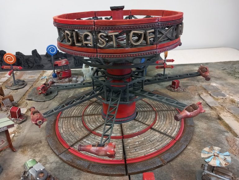 The blast off ride is a huge kit which is a very awkward model to put together. Despite the unwieldy model it looks great on the table.