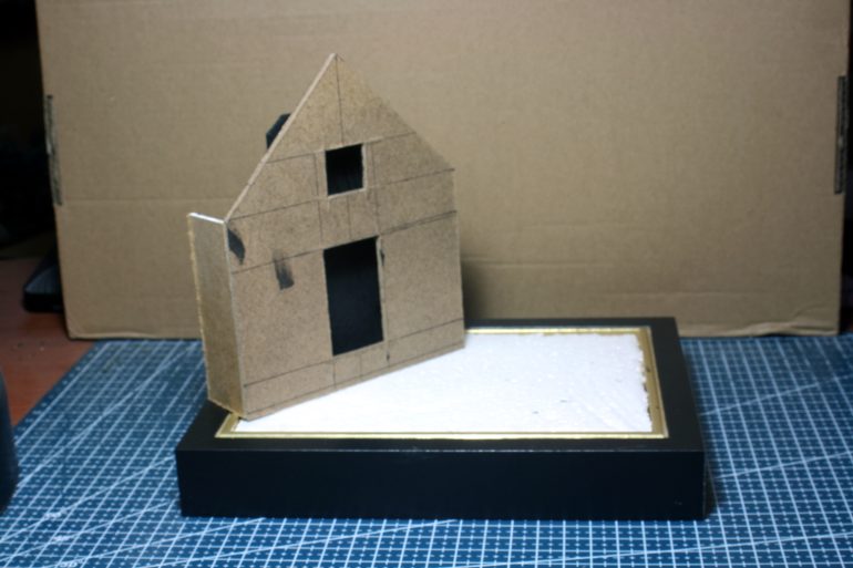 Establishing the size of the diorama (I tend to make them as compact as possible), and building the base of the structure with hard board treated with clear varnish.