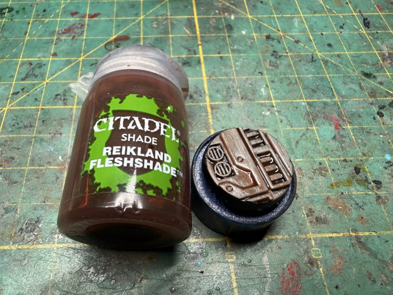 When the paint is dry (be patient), apply a wash of GW Reikland Fleshade and wipe pooling areas on the flat surfaces.