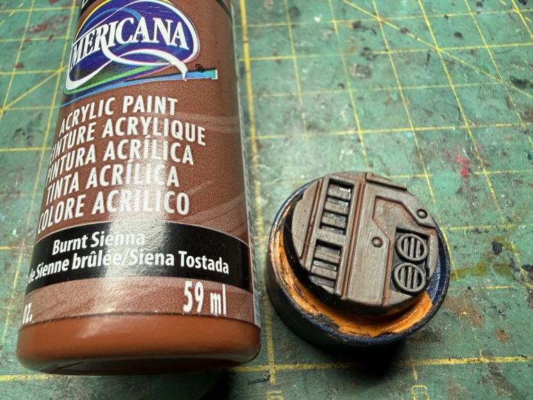 When the was is dry (again, be patient or you will make a mess), apply thin lines of Burnt Sienna between major elements of the base. It sounds harder than it is and is quite zen, plus it provides a rather kewl rust shadow to it all.